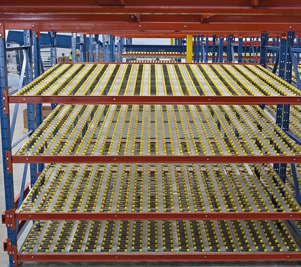 FIFO carton flow racking with inclined roller lanes for first-in-first-out picking