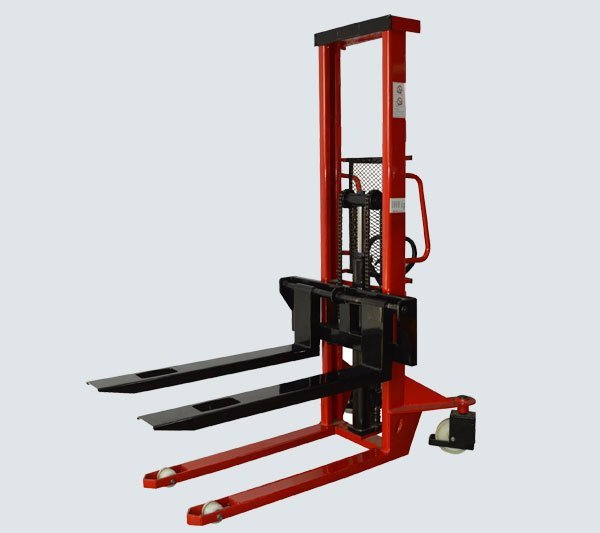 Manual hydraulic stacker lifting a pallet to a racking level