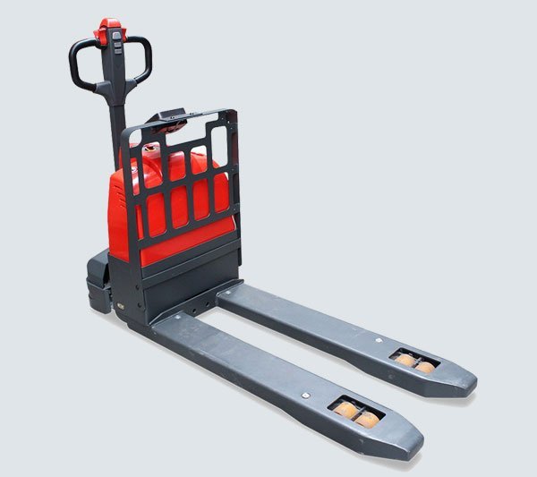 Battery powered electric pallet truck moving a pallet in a warehouse aisle