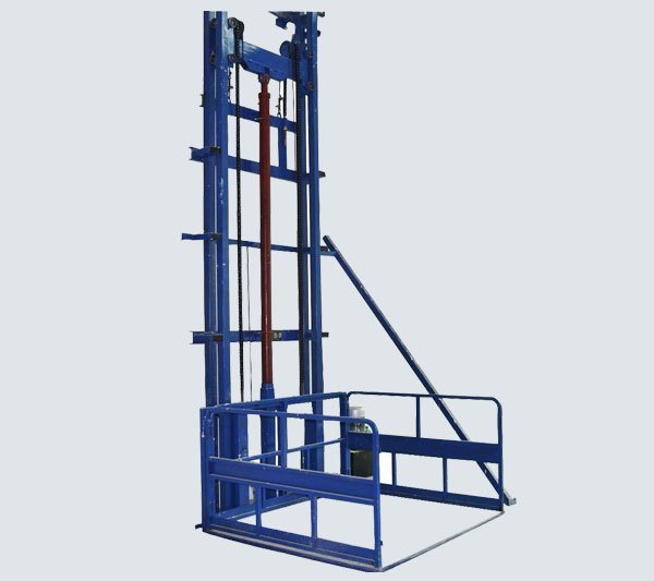Wall mounted hydraulic goods lift platform fixed to a warehouse wall