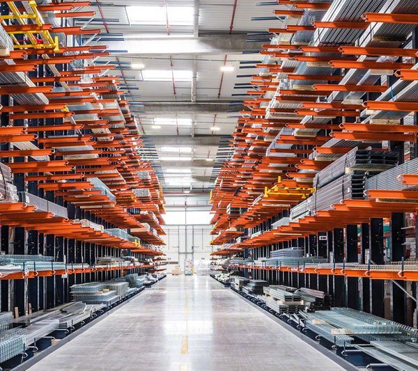 Cantilever rack with extended arms storing long pipes and steel sections